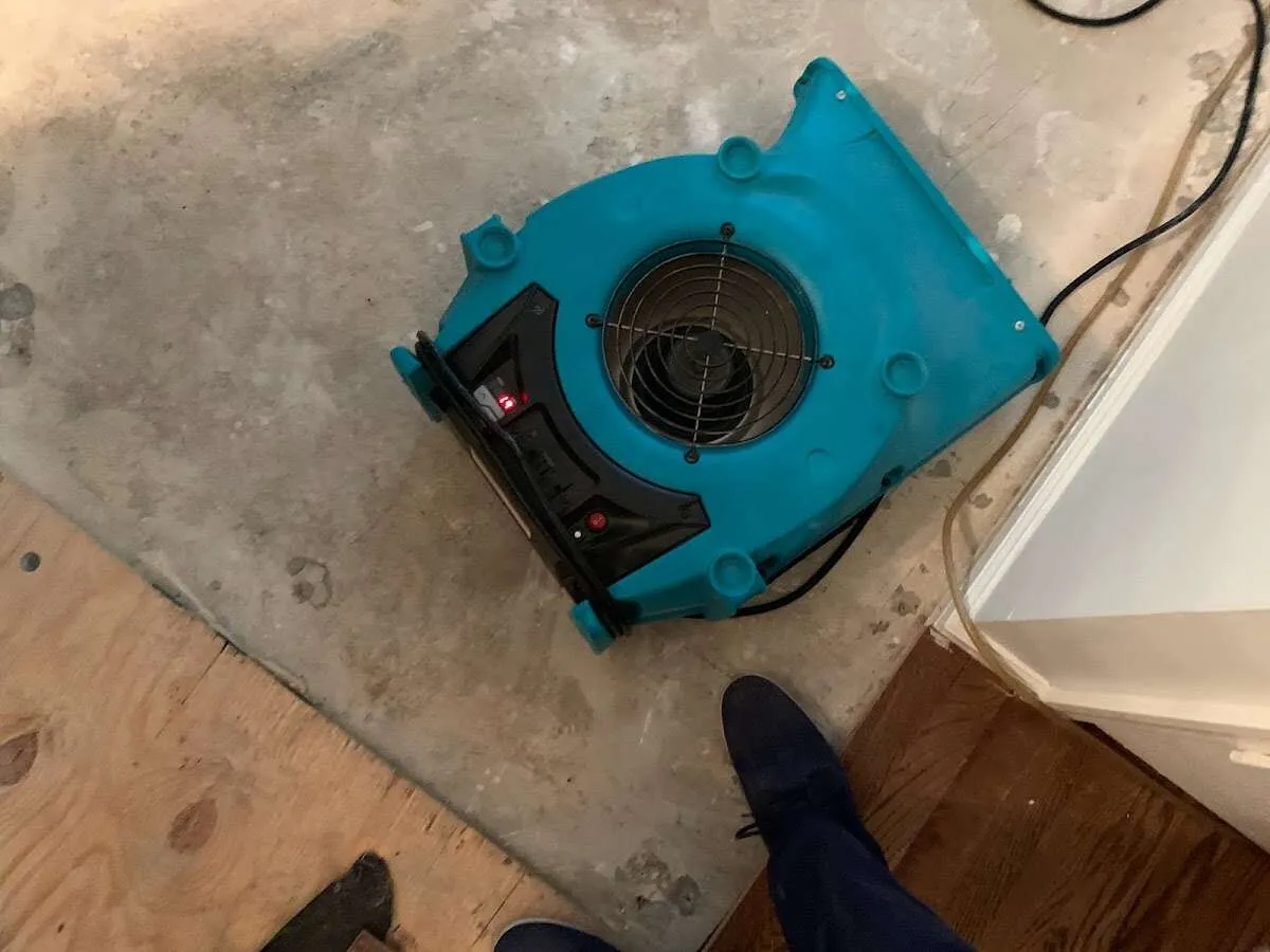Air mover drying subfloor during Leak Detection & Repair in Boxford